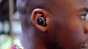 man wearing wireless raycon black earbuds
